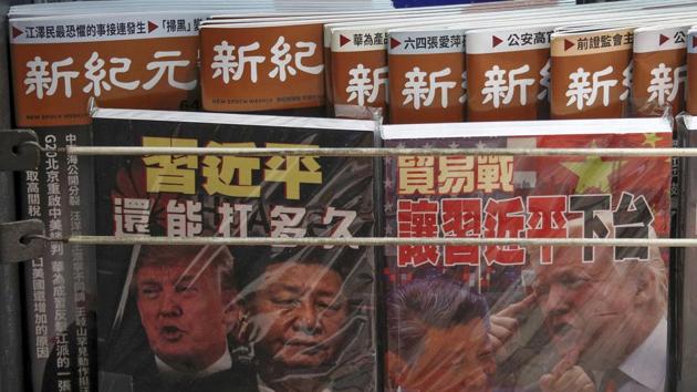 FILE - In this July 4, 2019, photo, Chinese magazines with front covers featuring Chinese President Xi Jinping and U.S. President Donald Trump on trade war are placed for sale at a roadside bookstand in Hong Kong. China on Thursday, Aug. 15, 2019 threatened retaliation if Washington steps up their war over trade and technology by going ahead with planned Sept. 1 tariff hikes on additional Chinese imports. (AP Photo/Andy Wong, File)(AP)