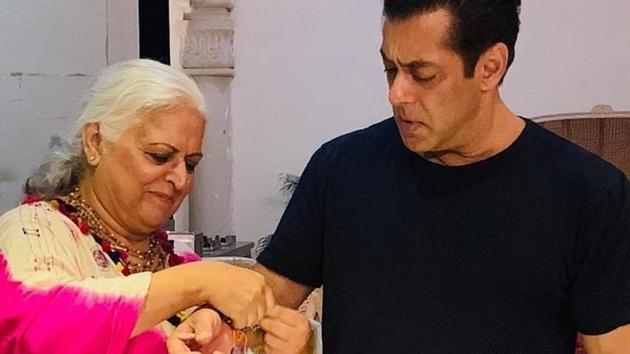 Bina Kak puts a rakhi on Salman Khan’s wrist. Bina Kak puts a rakhi on Salman Khan’s wrist.
