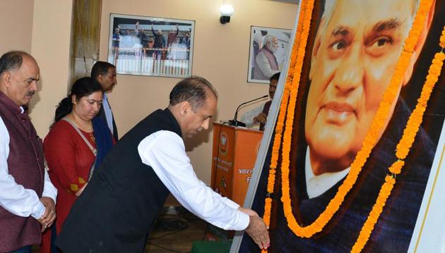 Chief minister Jai Ram Thakur paying floral tribute to former prime minister Atal Bihari Vajpayee on his first death anniversary at state BJP office Chakkar in Shimla on Friday. (Deepak Sansta/HT) Chief minister Jai Ram Thakur paying floral tribute to former prime minister Atal Bihari Vajpayee on his first death anniversary at state BJP office Chakkar in Shimla on Friday. (Deepak Sansta/HT)