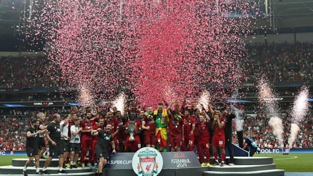 Liverpool's team poses with the trophy after winning the UEFA Super Cup 2019 football match between FC Liverpool and FC Chelsea at Besiktas Park Stadium in Istanbul. (OZAN KOSE / AFP) Liverpool's team poses with the trophy after winning the UEFA Super Cup 2019 football match between FC Liverpool and FC Chelsea at Besiktas Park Stadium in Istanbul. (OZAN KOSE / AFP)