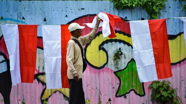 A man sells Indonesian national flags on a street ahead of the Indonesia Independence Day in Banda Aceh. Indonesia marks its Independence Day on August 17. (CHAIDEER MAHYUDDIN / AFP) A man sells Indonesian national flags on a street ahead of the Indonesia Independence Day in Banda Aceh. Indonesia marks its Independence Day on August 17. (CHAIDEER MAHYUDDIN / AFP)