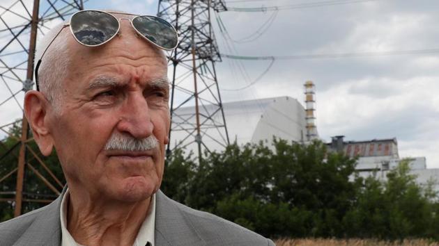 Ukrainian military pilot Mykola Volkozub looks on outside the New Safe Confinement (NSC) structure over the old sarcophagus covering the damaged fourth reactor at the Chernobyl Nuclear Power Plant, in Chernobyl, Ukraine July 5, 2019.(REUTERS PHOTO) Ukrainian military pilot Mykola Volkozub looks on outside the New Safe Confinement (NSC) structure over the old sarcophagus covering the damaged fourth reactor at the Chernobyl Nuclear Power Plant, in Chernobyl, Ukraine July 5, 2019.(REUTERS PHOTO)