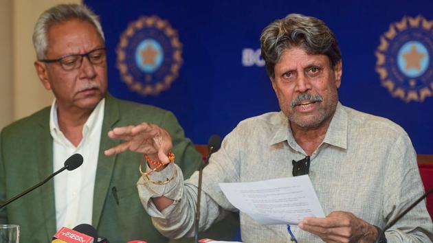 Former India captain and Chairman of Cricket Advisory Committee Kapil Dev interacts with media, as Anshuman Gaekwad, member Cricket Advisory Committee, looks on. Incumbent Ravi Shastri today, was re-appointed head coach of the Indian men's team.(PTI)