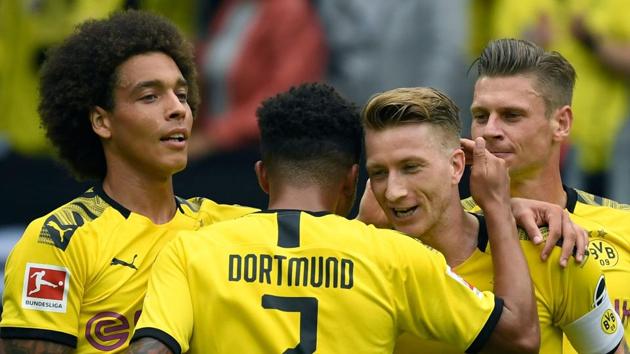 Dortmund's Belgian midfielder Axel Witsel, Dortmund's English midfielder Jadon Sancho, Dortmund's German forward Marco Reus and Dortmund's Polish defender Lukasz Piszczek (L-R) celebrate a goal. (AFP) Dortmund's Belgian midfielder Axel Witsel, Dortmund's English midfielder Jadon Sancho, Dortmund's German forward Marco Reus and Dortmund's Polish defender Lukasz Piszczek (L-R) celebrate a goal. (AFP)