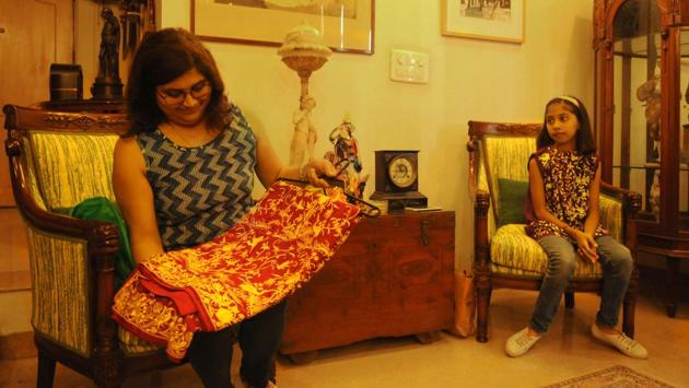 Shelley Subawalla and her daughter Sharmeen were a busy twosome at their Sector 31 residence, deciding on their outfits for Navroz. While Shelley zeroes in on a red saree with rich Gara embroidery, an heirloom piece, Sharmeen took to a traditional Parsi Jabla, in purple, and was to play the role of a Farohar at the event. Sharmeen said, “I go to practice twice a month and enjoy singing with my friends.” (Parveen Kumar / HT Photo) Shelley Subawalla and her daughter Sharmeen were a busy twosome at their Sector 31 residence, deciding on their outfits for Navroz. While Shelley zeroes in on a red saree with rich Gara embroidery, an heirloom piece, Sharmeen took to a traditional Parsi Jabla, in purple, and was to play the role of a Farohar at the event. Sharmeen said, “I go to practice twice a month and enjoy singing with my friends.” (Parveen Kumar / HT Photo)
