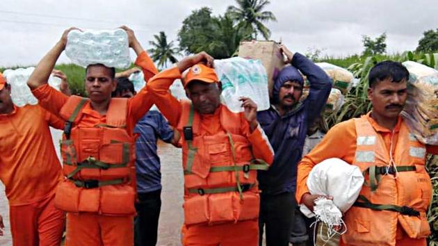 National Disaster Response Force (NDRF) continue the rescue and relief operations in Shirol, Kolhapur on Tuesday. NDRF teams also carrying fodder with them for affected animals. (ANI Photo) National Disaster Response Force (NDRF) continue the rescue and relief operations in Shirol, Kolhapur on Tuesday. NDRF teams also carrying fodder with them for affected animals. (ANI Photo)