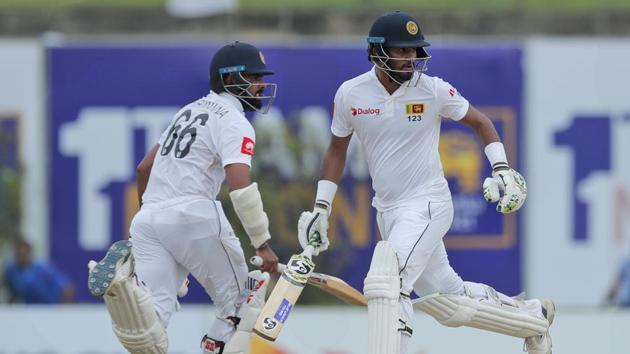 Sri Lanka's Dimuth Karunaratne, right, and Lahiru Thirimanne run between wickets. (AP) Sri Lanka's Dimuth Karunaratne, right, and Lahiru Thirimanne run between wickets. (AP)