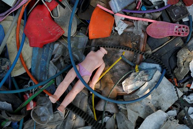 Indonesia’s crackdown on imported foreign waste has upset the village of Bangun, where residents say they earn more money sorting through piles of garbage than growing rice in once-lush paddy fields. The front and backyards of homes in Bangun overflow with waste on land that once had been used to grow rice. (Willy Kurniawan / REUTERS) Indonesia’s crackdown on imported foreign waste has upset the village of Bangun, where residents say they earn more money sorting through piles of garbage than growing rice in once-lush paddy fields. The front and backyards of homes in Bangun overflow with waste on land that once had been used to grow rice. (Willy Kurniawan / REUTERS)