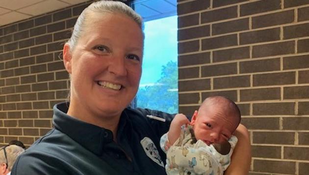Officer Melissa Carey with the baby she saved.(Facebook/@DanvilleVAPolice) Officer Melissa Carey with the baby she saved.(Facebook/@DanvilleVAPolice)