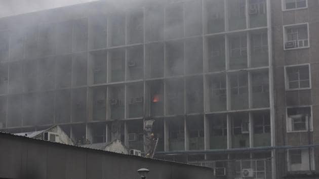 Firefighters at the site of a major fire that broke out in the 2nd floor of the PC block near the emergency ward at All India Institute of Medical Sciences (AIIMS), in New Delhi. (Sanjeev Verma/HT PHOTO) Firefighters at the site of a major fire that broke out in the 2nd floor of the PC block near the emergency ward at All India Institute of Medical Sciences (AIIMS), in New Delhi. (Sanjeev Verma/HT PHOTO)
