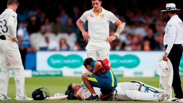 Australia's Steve Smith receives treatment as he lays on the floor after being hit by a ball from England's Jofra Archer as England's Jos Buttler and Australia's Pat Cummins look on(Action Images via Reuters)