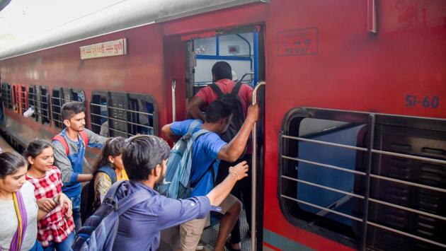 Passengers board the Pune-Mumbai train at Pune railway station on Saturday.(Sanket Wankhade/HT PHOTO)