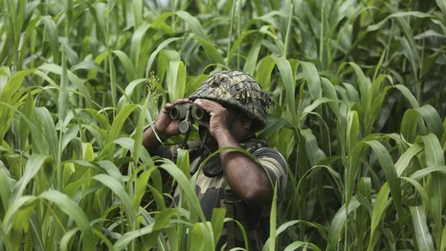 A Border Security Force (BSF) soldier keeps vigil near the India Pakistan border at Garkhal in Akhnoor, about 35 kilometre west of Jammu. Pakistan has denounced India’s actions to change the special status of the disputed Himalayan region of Kashmir and has downgraded its diplomatic ties with New Delhi. (Channi Anand / AP) A Border Security Force (BSF) soldier keeps vigil near the India Pakistan border at Garkhal in Akhnoor, about 35 kilometre west of Jammu. Pakistan has denounced India’s actions to change the special status of the disputed Himalayan region of Kashmir and has downgraded its diplomatic ties with New Delhi. (Channi Anand / AP)