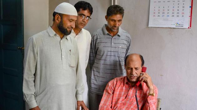 A man talks on phone after restoration of landline phones in some areas, at Sanatnagar in Srinagar, Kashmir. (PTI) A man talks on phone after restoration of landline phones in some areas, at Sanatnagar in Srinagar, Kashmir. (PTI)