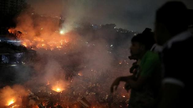 At least 10,000 people are homeless after a massive fire swept through a crowded slum in the Bangladesh capital. (Reuters Photo) At least 10,000 people are homeless after a massive fire swept through a crowded slum in the Bangladesh capital. (Reuters Photo)