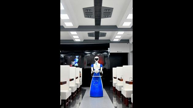 The robots are programmed to work efficiently and the staff has also undergone training from the manufacturers to attend to any issues that may arise over the course of operations. While the restaurant holds a unique appeal with its robot servers, it also lends a glimpse into one possible future for hospitality businesses and the mechanization of workforces. (Manjunath Kiran / AFP) The robots are programmed to work efficiently and the staff has also undergone training from the manufacturers to attend to any issues that may arise over the course of operations. While the restaurant holds a unique appeal with its robot servers, it also lends a glimpse into one possible future for hospitality businesses and the mechanization of workforces. (Manjunath Kiran / AFP)