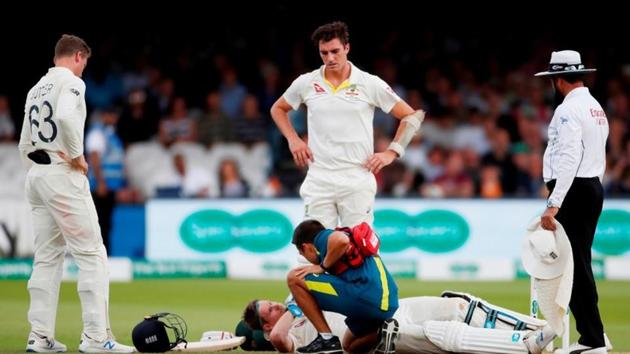 Australia's Steve Smith receives treatment as he lays on the floor after being hit by a ball from England's Jofra Archer(Action Images via Reuters)