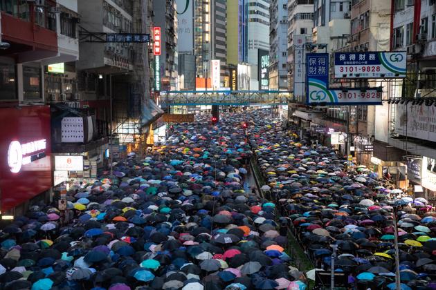 Demonstrators march during a protest in the Causeway Bay district of Hong Kong, China, on Sunday(Bloomberg Photo) Demonstrators march during a protest in the Causeway Bay district of Hong Kong, China, on Sunday(Bloomberg Photo)
