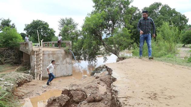 A bridge on the road leading to Naggal village in Majri block collapsed due to heavy rain.(Sanjeev Sharma/HT)