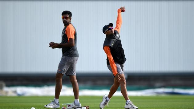 Kuldeep Yadav is watched by Ravichandran Ashwin during a nets session.(Getty Images)