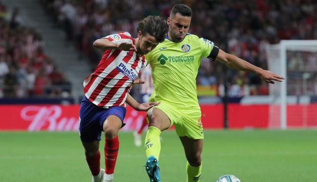 Atletico Madrid's Joao Felix in action with Getafe's Bruno.(REUTERS)