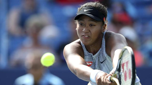 Naomi Osaka, of Japan, returns a shot. (AP) Naomi Osaka, of Japan, returns a shot. (AP)