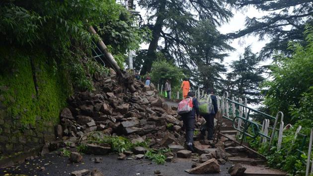 Students cross the debris after a landslide at Fingask Estate near Kalibari due to rain on Saturday morning, in Shimla. All educational institutions in Shimla, Kullu, Solan, Bilaspur and Sirmour will remain closed on Monday as heavy to extremely heavy rain continue to lash the state, district officials said. Authorities on Sunday issued orders to all schools, colleges, universities, and polytechnics asking them to remain shut. (Deepak Sansta / HT Photo) Students cross the debris after a landslide at Fingask Estate near Kalibari due to rain on Saturday morning, in Shimla. All educational institutions in Shimla, Kullu, Solan, Bilaspur and Sirmour will remain closed on Monday as heavy to extremely heavy rain continue to lash the state, district officials said. Authorities on Sunday issued orders to all schools, colleges, universities, and polytechnics asking them to remain shut. (Deepak Sansta / HT Photo)