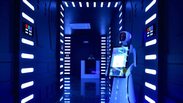 An interactive Android robot stands in the corridor on the opening day of the “Robot” restaurant in Bangalore. The restaurant has introduced one usher and five robots to interact and serve its customers food. (Manjunath Kiran / AFP) An interactive Android robot stands in the corridor on the opening day of the “Robot” restaurant in Bangalore. The restaurant has introduced one usher and five robots to interact and serve its customers food. (Manjunath Kiran / AFP)