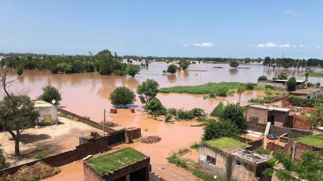 Rescue operations by team of Ludhiana Administration and NDRF underway in village Allowal in District Ludhiana. The team evacuated the houses after water from Satluj wrecked havoc. The fields were submerged in water causing heavy losses to the farmers, Ludhiana (Gurpreet Singh/Hindustan Times) Rescue operations by team of Ludhiana Administration and NDRF underway in village Allowal in District Ludhiana. The team evacuated the houses after water from Satluj wrecked havoc. The fields were submerged in water causing heavy losses to the farmers, Ludhiana (Gurpreet Singh/Hindustan Times)