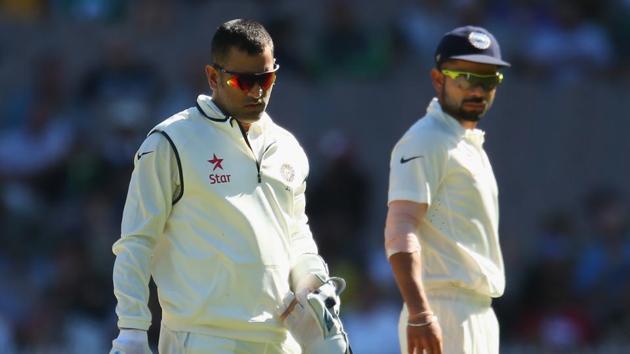 MS Dhoni and Virat Kohli of India look on in the field during day one of the Third Test match between Australia and India at Melbourne Cricket Ground on December 26, 2014 in Melbourne, Australia.(Getty Images)