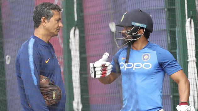 India's Kedar Jadhav, right, talks to batting coach Sanjay Bangar after batting in the nets.(AP)