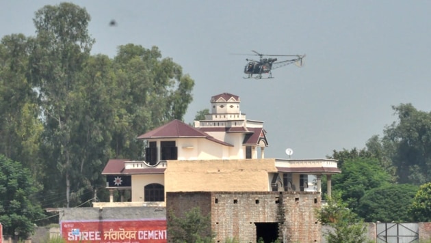 Deputy commissioner Sharma said airdropping of food packets would continue in the marooned villages with the help of Indian Army till the situation normalises. (HT Photo) Deputy commissioner Sharma said airdropping of food packets would continue in the marooned villages with the help of Indian Army till the situation normalises. (HT Photo)