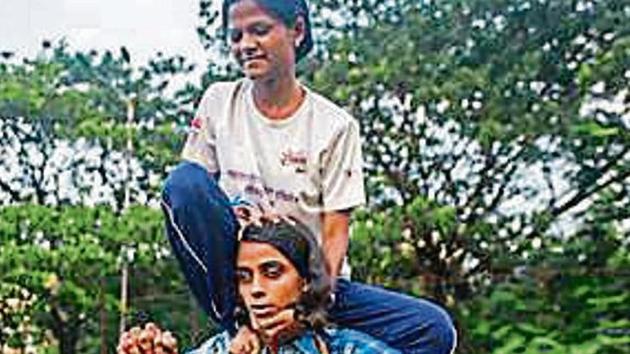 20 visually impaired women and girls from different parts of the city have been gathering at a ground in Matunga to practise their human pyramid formations. (HT FILE) 20 visually impaired women and girls from different parts of the city have been gathering at a ground in Matunga to practise their human pyramid formations. (HT FILE)