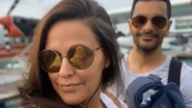 Neha Dhupia happily poses for the camera as Angad Bedi smiles. Neha Dhupia happily poses for the camera as Angad Bedi smiles.