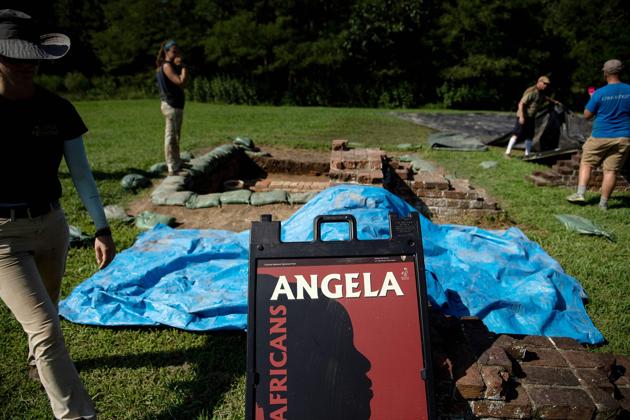 Archaeologists work in an area of a dig site associated with Angela. It was only 40 years after Angela’s arrival, in around 1660, that several English colonies in North America decreed that slave status would be transmitted via the mother. Interracial marriage was banned, a prohibition that continued in some US states well into the 20th century. After 1625, Angela disappears from the records, but her name is now more than ever in the spotlight in Jamestown. (Brendan Smialowski / AFP) 