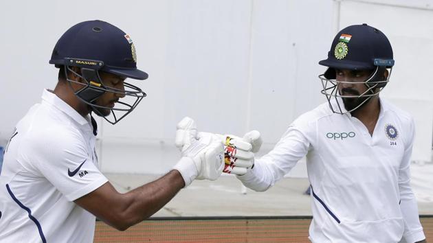 India openers KL Rahul, right, and Mayank Agarwal shake hands at the start of day one. (AP)