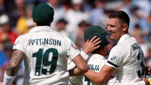 Australia's Josh Hazlewood celebrates with teammates after taking the wicket of England's Jos Buttler.(Action Images via Reuters)