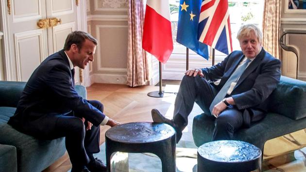 French President Emmanuel Macron and British Prime Minister Boris Johnson speak during a meeting at the Elysee Palace in Paris, France, August 22, 2019 (REUTERS)
