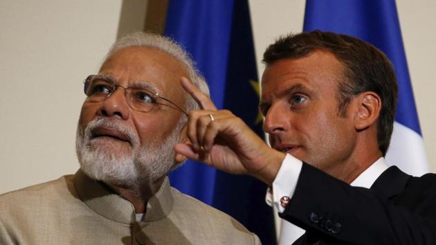 French President Emmanuel Macron, right, gestures next to Indian Prime Minister Narendra Modi after a joint press conference at the Chateau de Chantilly, north of Paris.(Photo: AP)