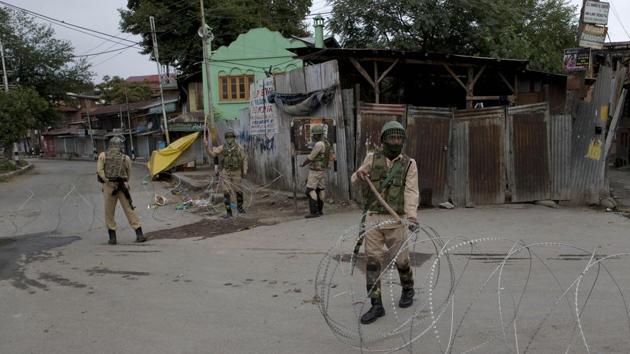 Meanwhile in Srinagar, to prevent uprisings, the government imposed an indefinite curfew, dotting city streets with military barricades manned by thousands of armed soldiers shouldering assault rifles. (Dar Yasin / AP) Meanwhile in Srinagar, to prevent uprisings, the government imposed an indefinite curfew, dotting city streets with military barricades manned by thousands of armed soldiers shouldering assault rifles. (Dar Yasin / AP)