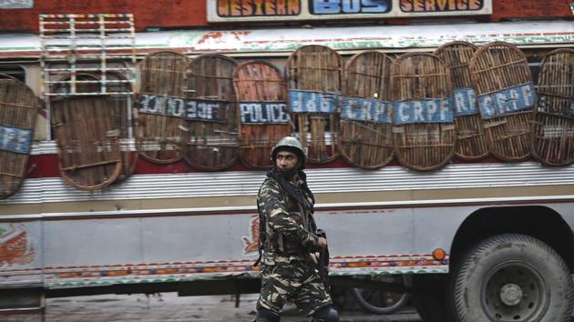 A paramilitary soldier patrols a street in Srinagar. For days before the dramatic changes in the status of Jammu and Kashmir state took place, rumors swirled in Kashmir that something big was afoot. New Delhi deployed thousands of troops to the Himalayan valley which was already one of the most militarized regions on Earth. (Mukhtar Khan / AP) A paramilitary soldier patrols a street in Srinagar. For days before the dramatic changes in the status of Jammu and Kashmir state took place, rumors swirled in Kashmir that something big was afoot. New Delhi deployed thousands of troops to the Himalayan valley which was already one of the most militarized regions on Earth. (Mukhtar Khan / AP)
