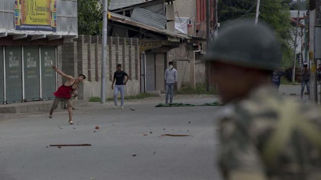 Kashmiri protesters pelt stones at paramilitary soldiers during curfew like restrictions in Srinagar. Such protests increased over time after the revocation of special status to the valley. (Dar Yasin / AP) Kashmiri protesters pelt stones at paramilitary soldiers during curfew like restrictions in Srinagar. Such protests increased over time after the revocation of special status to the valley. (Dar Yasin / AP)