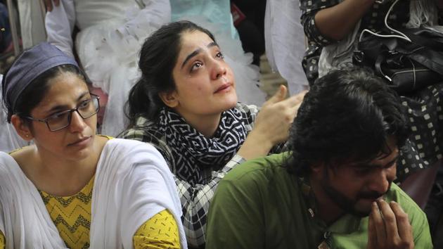 A woman breaks down after listening to a fellow Kashmiri narrating memories of past Eid in the valley as Kashmiris living in New Delhi gathered for a function to observe Eid al-Adha away from their homes. (Manish Swarup / AP) A woman breaks down after listening to a fellow Kashmiri narrating memories of past Eid in the valley as Kashmiris living in New Delhi gathered for a function to observe Eid al-Adha away from their homes. (Manish Swarup / AP)