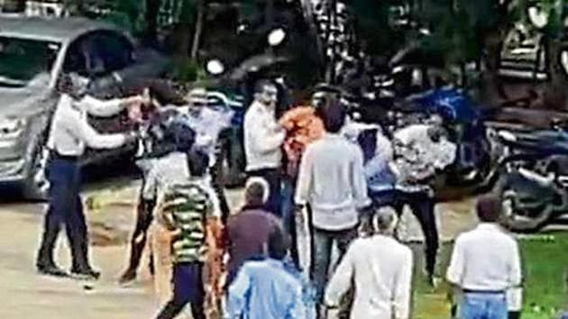 CCTV footage of the incident where a group of unidentified men hunted down a 31-year-old man, whose car theirs had collided with, to his housing society, beat him up and stole his watch, car keys and documents. (HT FILE/SOURCED) CCTV footage of the incident where a group of unidentified men hunted down a 31-year-old man, whose car theirs had collided with, to his housing society, beat him up and stole his watch, car keys and documents. (HT FILE/SOURCED)