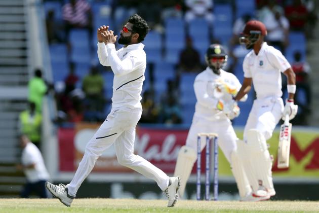 India's Ravindra Jadeja bowls against West Indies during day two of the first Test cricket match. (AP) India's Ravindra Jadeja bowls against West Indies during day two of the first Test cricket match. (AP)