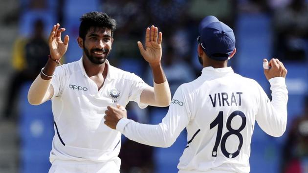 India's Jasprit Bumrah celebrates with team captain Virat Kohli the dismissal of West Indies' Darren Bravo.(AP)