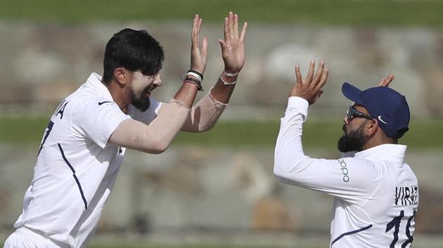 India's Ishant Sharma, left, celebrates with team captain India's captain Virat Kohli the dismissal of West Indies' Roston Chase during day two of the first Test cricket match at the Sir Vivian Richards cricket ground in North Sound, Antigua and Barbuda, Friday, Aug. 23, 2019. (AP) India's Ishant Sharma, left, celebrates with team captain India's captain Virat Kohli the dismissal of West Indies' Roston Chase during day two of the first Test cricket match at the Sir Vivian Richards cricket ground in North Sound, Antigua and Barbuda, Friday, Aug. 23, 2019. (AP)