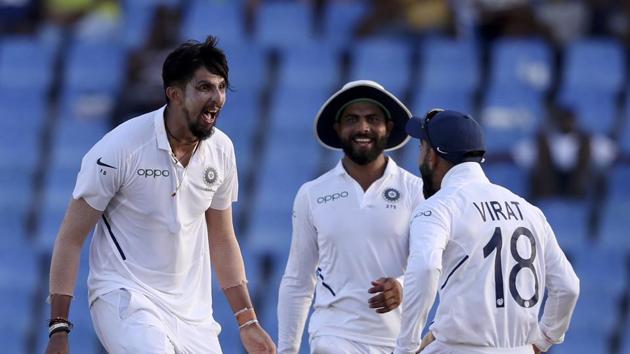 India's Ishant Sharma celebrates with captain Virat Kohli the dismissal of West Indies' Kemar Roach. (AP)