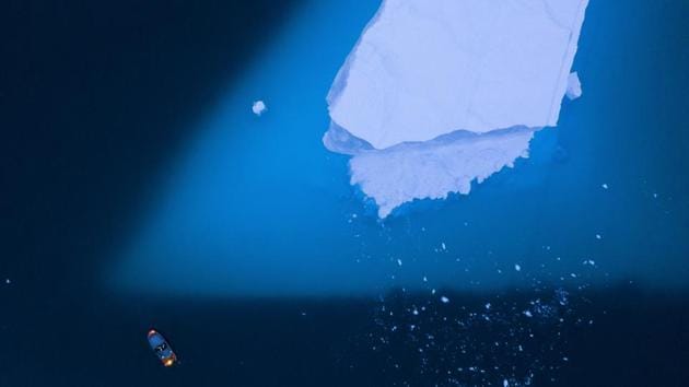 A boat navigates next to a large iceberg in eastern Greenland. Summer this year is hitting Greenland hard with record-shattering heat and extreme melt. By the end of the summer, about 440 billion tons (400 billion metric tons) of ice — maybe more — will have melted or calved off Greenland’s giant ice sheet, scientists estimate. That’s enough water to flood Pennsylvania or the country of Greece about a foot (35 centimetre) deep. (Felipe Dana / AP) A boat navigates next to a large iceberg in eastern Greenland. Summer this year is hitting Greenland hard with record-shattering heat and extreme melt. By the end of the summer, about 440 billion tons (400 billion metric tons) of ice — maybe more — will have melted or calved off Greenland’s giant ice sheet, scientists estimate. That’s enough water to flood Pennsylvania or the country of Greece about a foot (35 centimetre) deep. (Felipe Dana / AP)