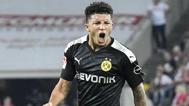 Dortmund's Jadon Sancho celebrates after scoring during the German Bundesliga.(AP)